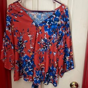 This is a tie bottom shirt. Lightweight and bright